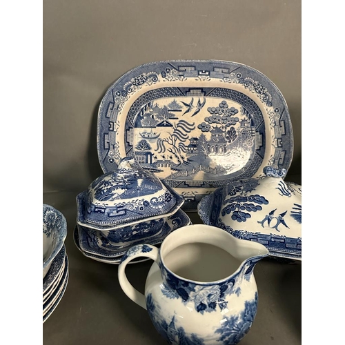 385 - A large quantity of blue and white china to include plates, platters and serving dishes