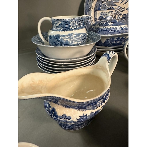 385 - A large quantity of blue and white china to include plates, platters and serving dishes