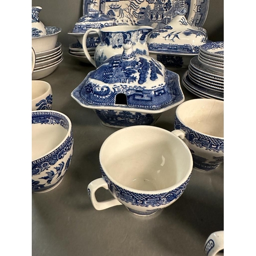 385 - A large quantity of blue and white china to include plates, platters and serving dishes