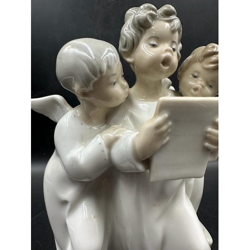 388 - A Lladro figure of three angelic choristers