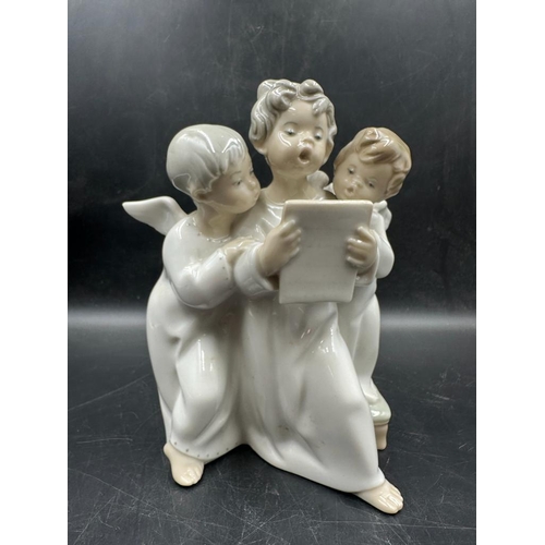 388 - A Lladro figure of three angelic choristers