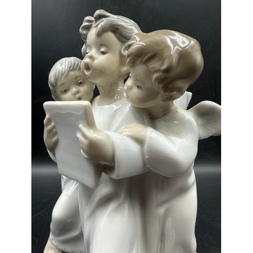 388 - A Lladro figure of three angelic choristers