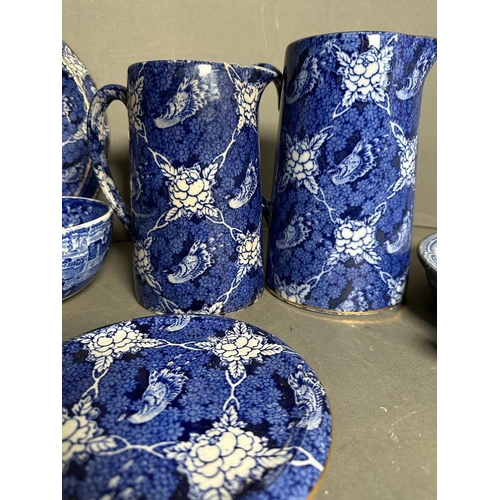 398 - A selection of blue and white ceramics to include a butler dish, Victorian plate warmer and jugs, va... 