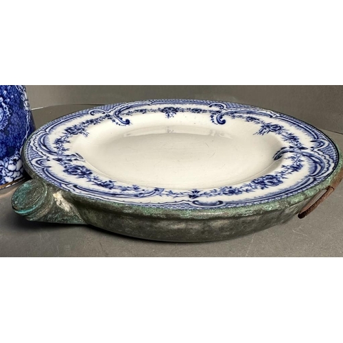 398 - A selection of blue and white ceramics to include a butler dish, Victorian plate warmer and jugs, va... 