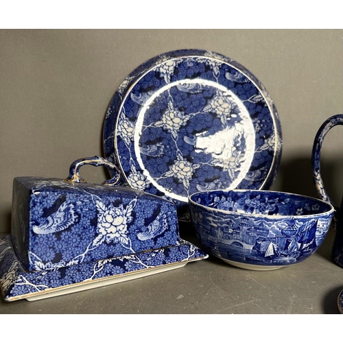 398 - A selection of blue and white ceramics to include a butler dish, Victorian plate warmer and jugs, va... 