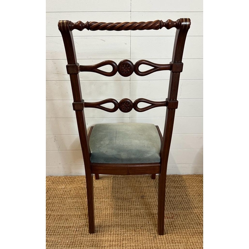 40 - Eight mahogany Regency style dining chairs with carved backs and brass string inlay to include two c... 