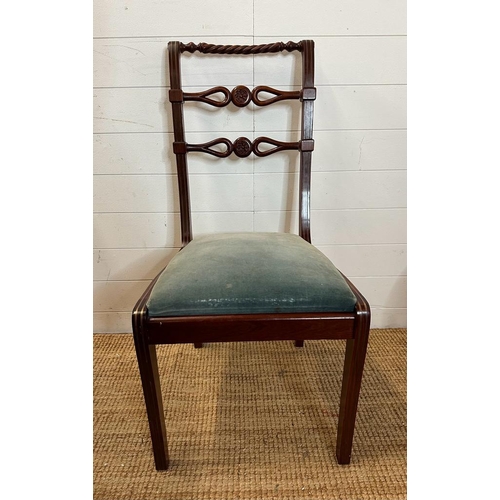 40 - Eight mahogany Regency style dining chairs with carved backs and brass string inlay to include two c... 