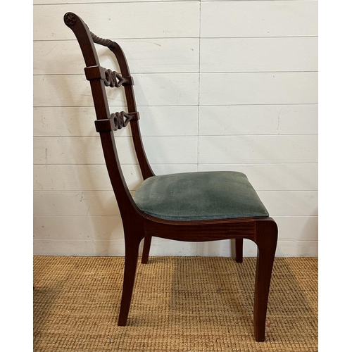 40 - Eight mahogany Regency style dining chairs with carved backs and brass string inlay to include two c... 