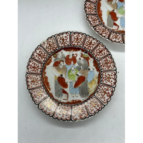 403 - A pair of Japanese plates, the centre enamel decorated with elders and scrolling pattern to edge (Di... 