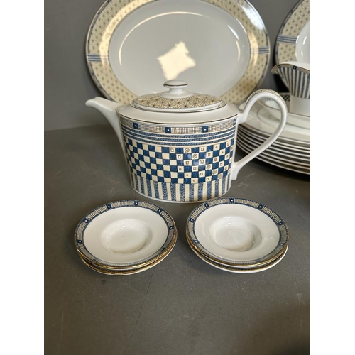 408 - A part Wedgewood Samurai tea/dinner service to include tea pot, coffee pot, platers and plates