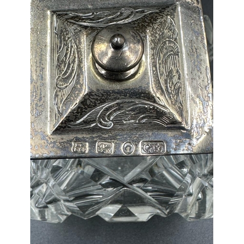 428 - A Victorian cut glass and silver topped inkwell on a pierced silver stand with foliate decoration, h... 