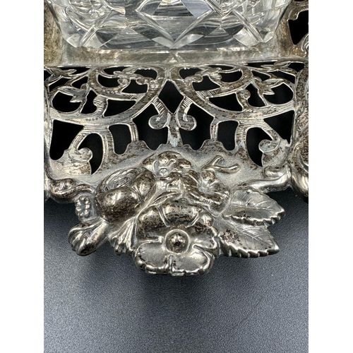 428 - A Victorian cut glass and silver topped inkwell on a pierced silver stand with foliate decoration, h... 