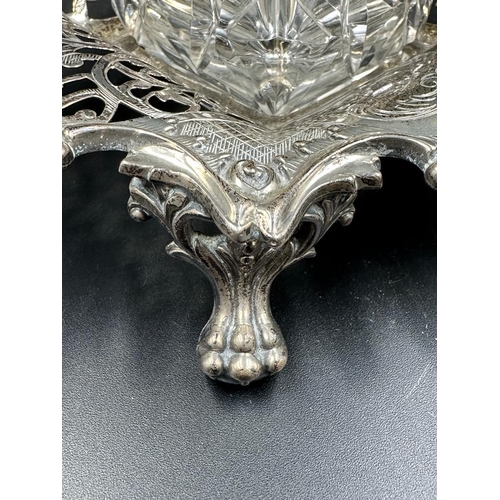 428 - A Victorian cut glass and silver topped inkwell on a pierced silver stand with foliate decoration, h... 