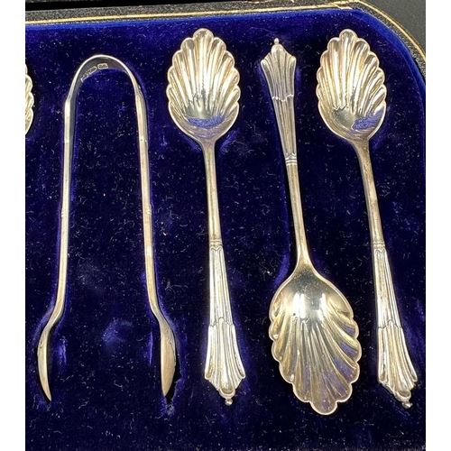 431 - A cased set of six teaspoons with shell bowls and a pair of sugar nips, hallmarked for London 1902 b... 