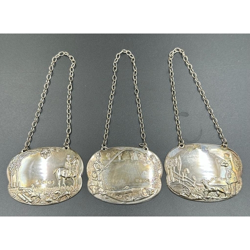 432 - A set of three silver country pursuit decanter labels by David Shaw Silverware Ltd, hallmarked for L... 