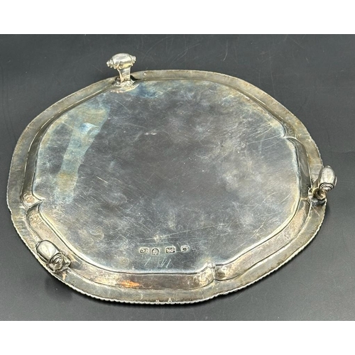 443 - A George III silver three footed tray, diameter 20cm, hallmarked for London 1769, makers mark I.C, a... 