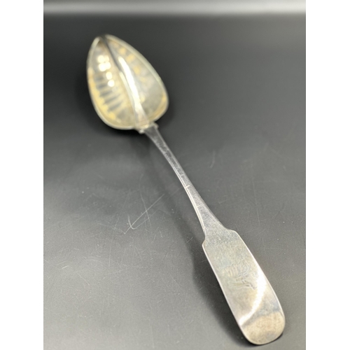 454 - Irish Silver: A George III silver straining spoon, hallmarked for Dublin 1808 by Richard Sawyer with... 