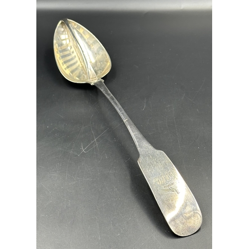 454 - Irish Silver: A George III silver straining spoon, hallmarked for Dublin 1808 by Richard Sawyer with... 