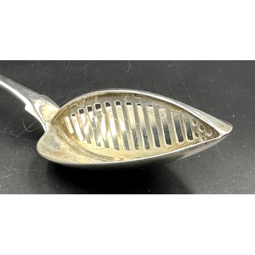 454 - Irish Silver: A George III silver straining spoon, hallmarked for Dublin 1808 by Richard Sawyer with... 