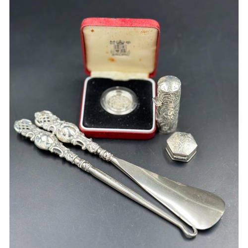 460 - A selection of silver curios to include a silver proof £1 coin