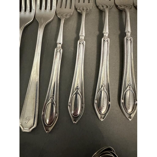 462 - A six place setting cutlery set by Insignia Plate along with some other plated cutlery.