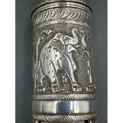 465 - A Filigree and pierced silver scroll holder, decorated with elephants and camels, blank cartouche an... 