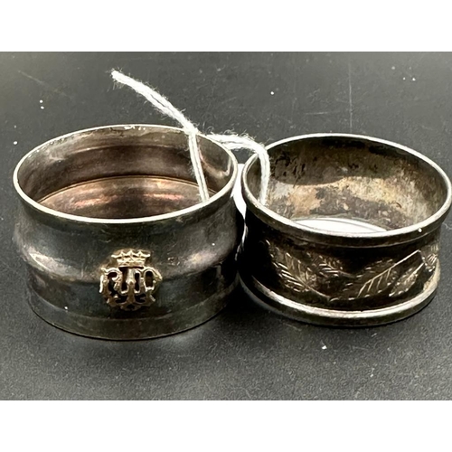 466 - A silver napkin ring and one white metal napkin ring