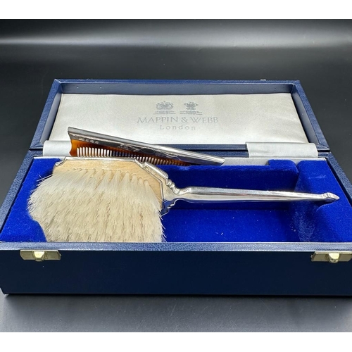 468 - A Mappin and Webb hallmarked Child's silver brush and comb set, cased with original receipt.