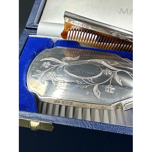 468 - A Mappin and Webb hallmarked Child's silver brush and comb set, cased with original receipt.