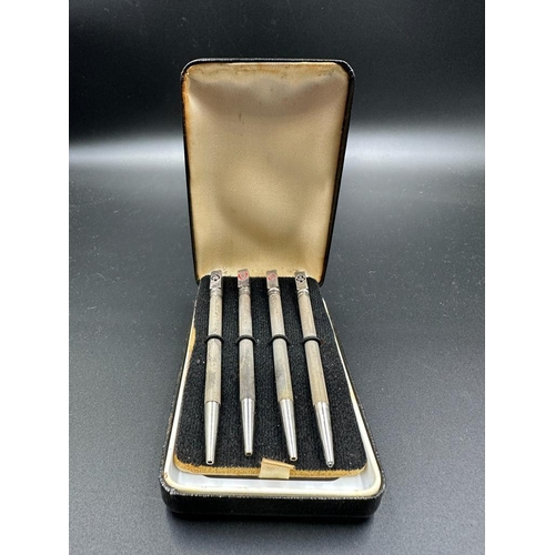 470 - A boxed set of sterling silver bridge pencils