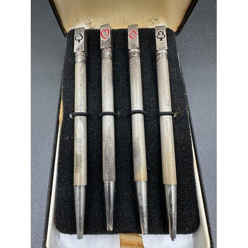 470 - A boxed set of sterling silver bridge pencils