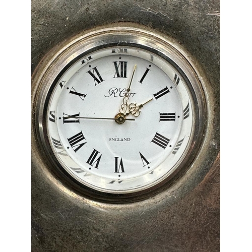 478 - A silver easel backed clock by R Carr, hallmarked for Sheffield. H 9cm