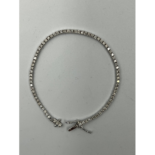 555 - An 18ct white gold Tennis or line bracelet set with approximately 3ct of diamonds.