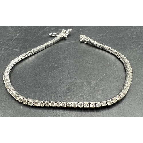 555 - An 18ct white gold Tennis or line bracelet set with approximately 3ct of diamonds.