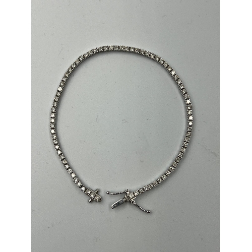 555 - An 18ct white gold Tennis or line bracelet set with approximately 3ct of diamonds.