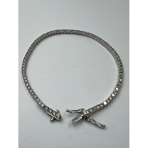 555 - An 18ct white gold Tennis or line bracelet set with approximately 3ct of diamonds.