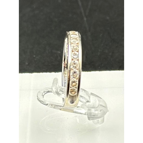 557 - A 14ct white gold half eternity style ring, approximate total weight 3.4g and size N. Being sold on ... 