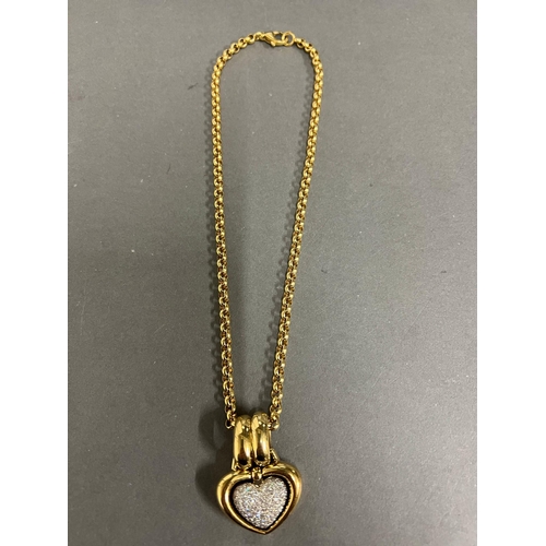 565 - An 18ct gold and pave diamond open heart shaped pendant. Rounded Belcher chain approximately 440mm l... 