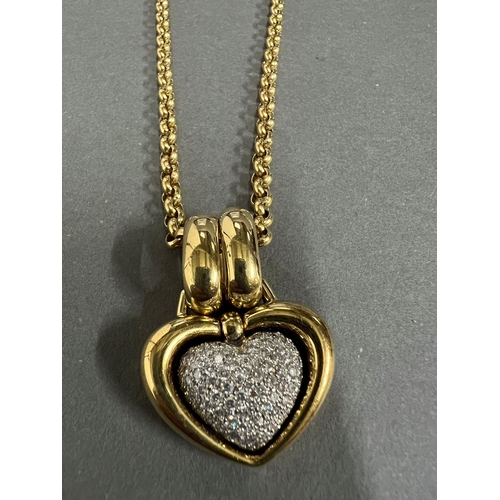 565 - An 18ct gold and pave diamond open heart shaped pendant. Rounded Belcher chain approximately 440mm l... 