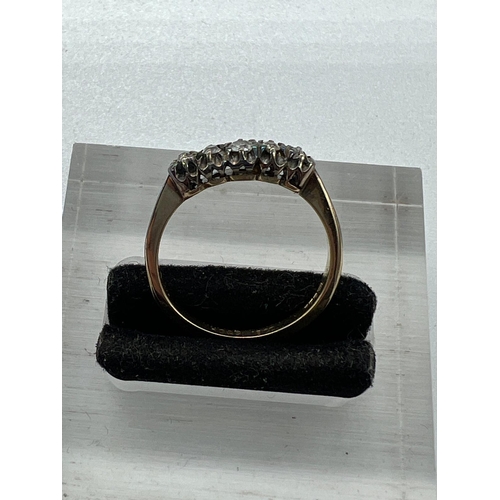 573 - An 18ct five stone diamond ring, approximate size N