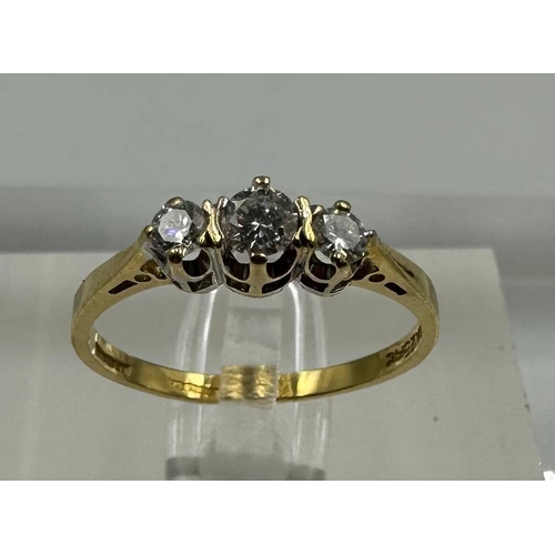 575 - An 18ct three stone diamond ring, approximate size M1/2