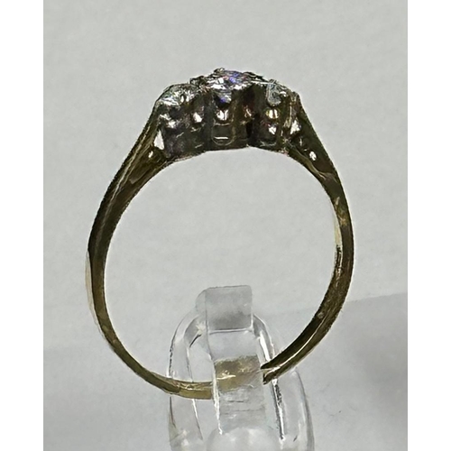 575 - An 18ct three stone diamond ring, approximate size M1/2