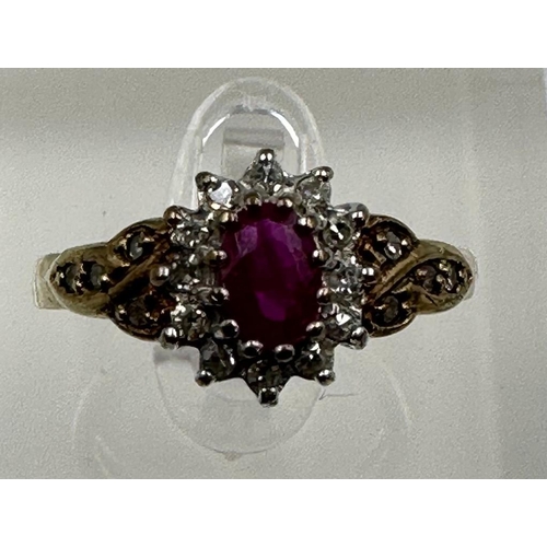 577 - A 9ct gold ruby and diamond ornate ring in yellow gold setting, approximate size O1/2