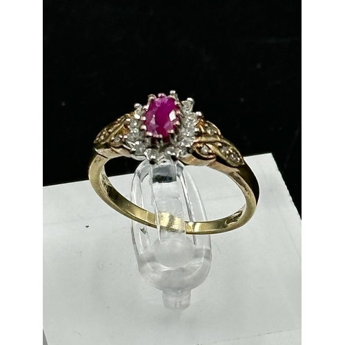 577 - A 9ct gold ruby and diamond ornate ring in yellow gold setting, approximate size O1/2