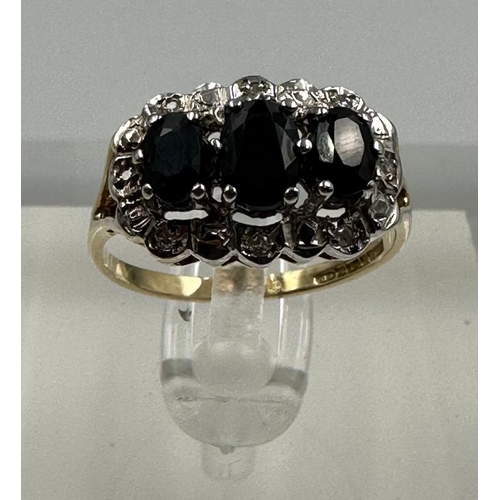 578 - A 9ct gold diamond and sapphire ring, approximate size M1/2