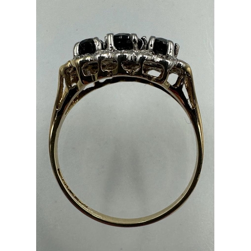 578 - A 9ct gold diamond and sapphire ring, approximate size M1/2