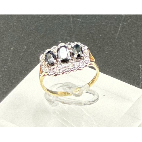 578 - A 9ct gold diamond and sapphire ring, approximate size M1/2