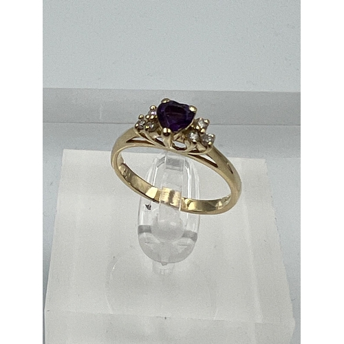 580 - A 14ct gold amethyst and diamond shoulders with a heart shaped central stone on a 14ct yellow gold s... 