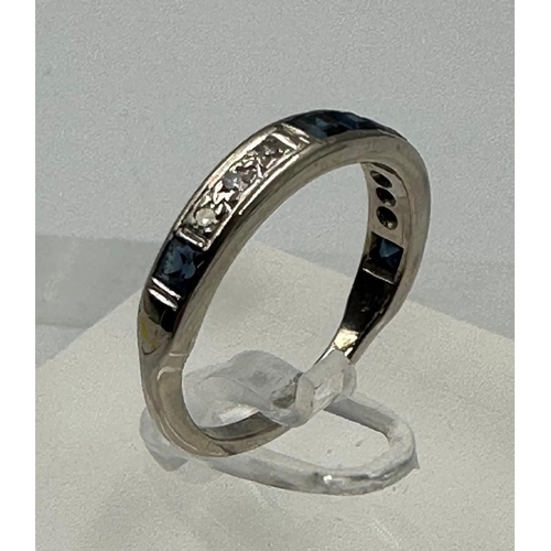 583 - A diamond and sapphire, half eternity style ring set in 18ct white gold, approximate size M