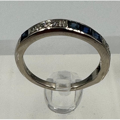 583 - A diamond and sapphire, half eternity style ring set in 18ct white gold, approximate size M